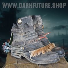 Step into the dystopian world with our rugged motorcycle boots designed not only for functionality but also adorned with various accessories in a post-apocalyptic style. These unique boots are the perfect companions for making a bold statement in a world after the collapse. Material and Craftsmanship: Crafted from high-quality and resilient materials, these motorcycle boots withstand the harshest conditions of the post-apocalyptic world. Precision in craftsmanship ensures not only durability but Leather Boots With Rivets For Cosplay, Post Apocalyptic Accessories, Biker Boots Women, Post Apocalyptic Outfit, Apocalyptic Costume, Shoes Boots Combat, Apocalyptic Wasteland, Dystopian World, Post Apocalyptic Costume