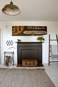 a living room filled with furniture and a fire place in front of a painting on the wall