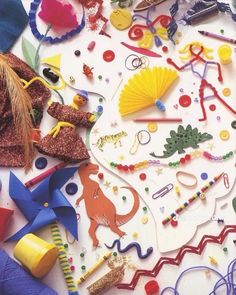 there are many different items on the table together, including scissors and other crafting supplies