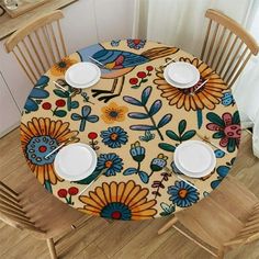 an image of a table setting with plates and place settings on the dining room table