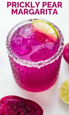 a purple drink in a glass with limes on the side and text overlay that reads prickly pear margarita