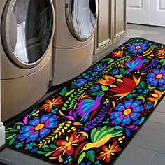 a colorfully painted door mat next to washer and dryer in a laundry room