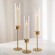 three candles are sitting on top of each other