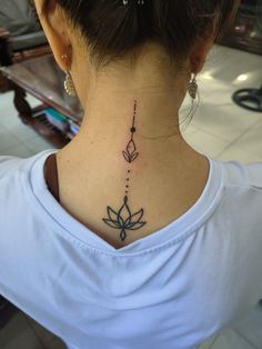 a woman with a tattoo on her neck