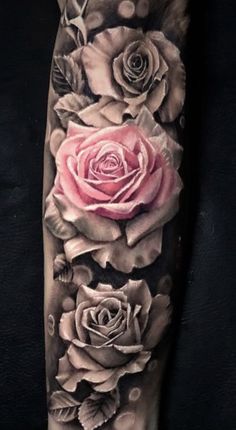 a black and white tattoo with roses on it