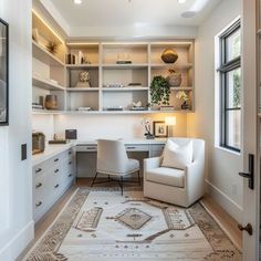 a white chair sitting next to a desk in a room filled with bookshelves