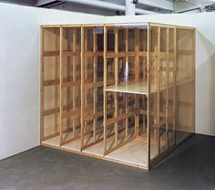 an unfinished room with wooden shelves in it