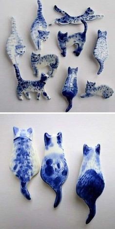 blue and white ceramic cat figurines are shown in three different positions, one is upside down