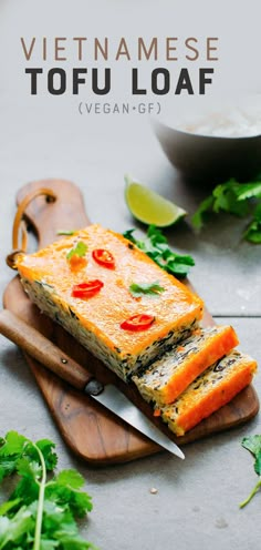 the vietnamese tofu loaf is cut in half on a cutting board