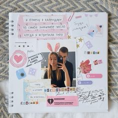 a scrapbook with an image of a man and woman taking a selfie on their cell phone