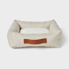 Offer a comfortable spot for your pet to curl up and sleep with this Neutral 4-Sided Bolster Dog Bed from Boots & Barkley™. This rectangular dog bed in a neutral cream color coordinates with any home decor. Designed with raised bolster sides, it creates an enclosed space for your pet to sleep and rest their head. The soft foam fill provides cushioned comfort and support, while the faux-shearling surface offers them a soft and cozy surface. The nonskid base helps keep the bed in place, and the ca Bolster Dog Bed, Cozy Dog Bed, Cozy Dog, Floral Cat, Material Bed, Blue Boots, Love Your Pet, Dog Blanket, Blue Bedding