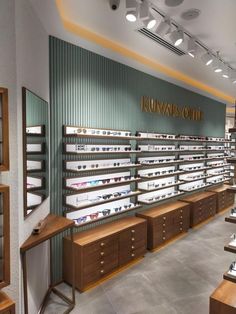 the inside of a jewelry store filled with lots of wooden shelves and glass display cases