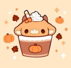 a cupcake with whipped cream and pumpkins around it