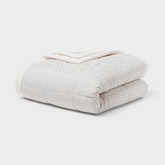 two white blankets folded on top of each other