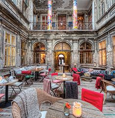 the inside of an old building with tables and chairs