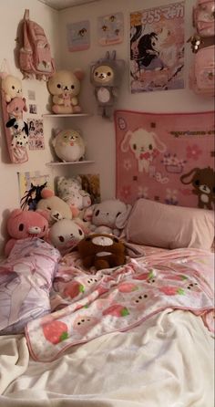 a bed with many stuffed animals on it