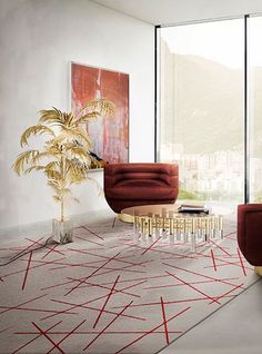 a living room filled with red furniture and large glass doors leading to a balcony overlooking the city