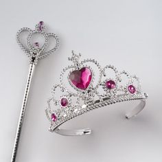 a tiara and a key on a white background