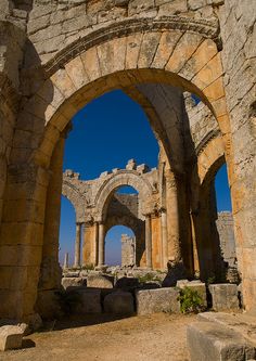 an arch in the middle of a stone building