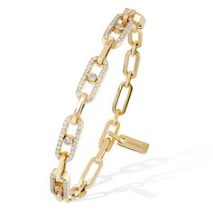 For lovers of modern yet timeless jewelry, this Move Link diamond riviere bracelet in yellow gold is a real favorite. Playing on the repetition of the Maison's iconic motif and its moving diamonds, this women's bracelet embraces your wrist with a line of sparkling light. Easy to wear on a daily basis, it goes perfectly with your other Messika jewelry for a fashionable and daring look. We especially admire the suppleness and elegance of the clasp, which is in keeping with the Maison's jewelry exp Luxury Diamond Bracelet With Solid Link For Anniversary, Messika Jewelry, Parisian Jewelry, Yellow Gold Bracelet, Timeless Jewelry, Rose Gold Diamonds, For Lovers, Luxury Jewelry, Link Bracelets