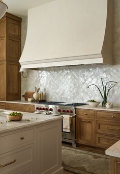 a kitchen with an oven, stove and counter tops in it's center island