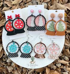 the earrings are decorated with different designs and colors