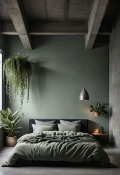 a bed with green sheets and pillows in a room next to a window, potted plants on the wall