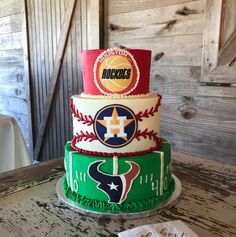 three tiered cake decorated with different sports logos