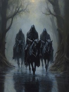 three people riding horses through a forest on a foggy day