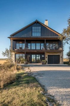 a large house sitting in the middle of a field