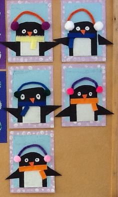 penguins with headphones on each one are made out of construction paper and stringing