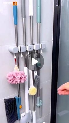 there is a shower caddy with cleaning supplies hanging on it