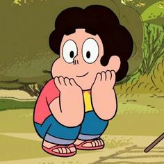 a cartoon character sitting on the ground with his hands to his face