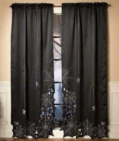 black curtains with spider webs on them