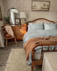 a bed sitting in a bedroom next to a dresser