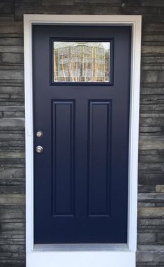 a blue front door with two sidelights