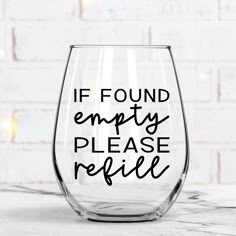 a wine glass with the words if found empty please relie on it in black ink