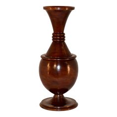 a wooden vase sitting on top of a table