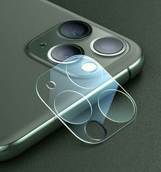 an iphone with two cameras attached to it's back cover, and the camera lens is clearly visible