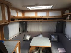 the inside of a camper with lots of storage space