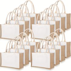 six bags with handles are lined up against each other, one is white and the other is beige