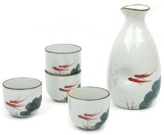 a set of four glass cups and a vase on a white surface with red birds painted on it