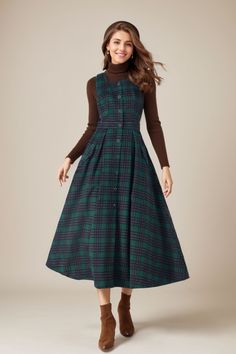 ★★ FEATURES * 30% wool, other fiber,nylon * Polyester lining * Two side pockets * Right side zipper closure * Sleeveless dress * Fitted waist dress * Plaid wool dress * A Line Dress  * Perfect for Winter, autumn * Dry clean * White blouse is not sale items ★★ The model is 170 cm (5′ 7″) tall with a 80 cm (31.5") bust, 66 cm (26") waist. She is wearing the wool dress in size XS. ★★ Bespoke Order Service If you Request other color Request the length Request a sleeve Your height is not between 155 cm- 172 cm Your weight is over 75 kg I can do it for you, It will need some extra fee depending on on your need. Contact with me for more detail. ★★ Get your size in Size Chart with your body measurement https://www.etsy.com/listing/794055682 ★★ Warmly Note: 1 ) : Please confirm your shipping addres Wool Long Dress, Women’s Winter Dresses, Plaid Wool Dress, Tartan Dress Outfit, Wool Dress Outfit, Winter Plaid Collared Dresses, Classic A-line Wool Dress, Retro Plaid Winter Dresses, Wool Dress Winter