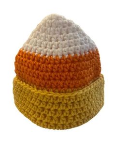 three crocheted hats are stacked on top of each other, one is orange and the other is white