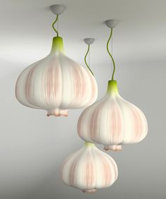 three bulbs of garlic hanging from the ceiling