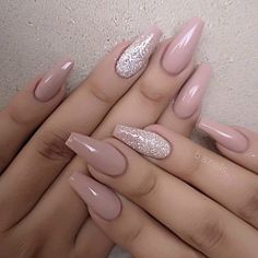 two hands with pink and white nail polishes on their nails, one is holding the other