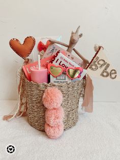 a basket filled with lots of items on top of a white floor