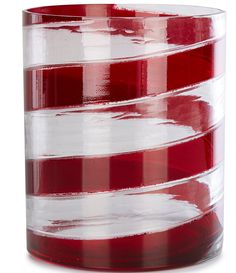 a red and white striped vase sitting on top of a table in front of a white background