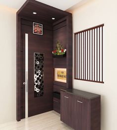 an empty room with some plants on the wall and a wooden cabinet next to it