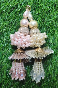 Indian Handmade Latkan Tassels for Saree Blouse Lehenga HandBags Hangings Dupatta Decoration Bridal Wedding dress for Women pair of 2 pcs Size - 11.00 cm Length  Item Description You can use this Beautiful pair of tassle for several DIY projects.  *These beautiful Tassel Latkans are used as the accessory for saree blouse on the back, but u can use according to your need and your innovative ideas. * Package contains 2 Latkan / 1 Pair Other Than Saree Blouse, you can use these latkans in various ways Craft Projects Designing Home Decoration Festive celebrations. Evening and party Apparels. Home décor items Apparel & Fashion Scarves n Stoles Headband, hats Table cover, curtains, Pillow covers, Cushion cover Shoe designing Headband, hats Table cover, curtains Designing stylish blouses Ship Fro Latkan For Lehenga Handmade, Tassels For Saree, Latkan Tassels, Saree Bluse, Wedding Dress For Women, Sari Lehenga, Blouse Lehenga, Diy Floral Decor, Happy Ganesh Chaturthi Images